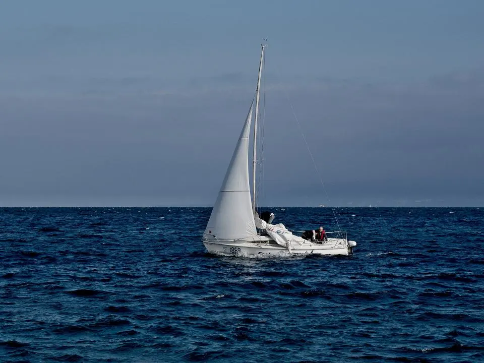 A small sailboat out on open water